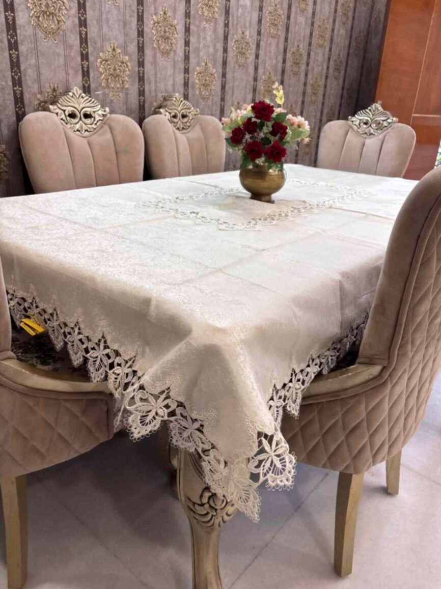Elegant beige jacquard tablecloth with detailed floral lace edges and center design. Ideal for upscale dining, events, or daily luxury.